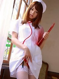 Naughty asian nurse slowly takes off her uniform showing lingerie