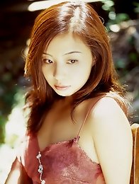 Long haired asian babe posing with her delicious body in a bikini