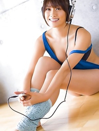 Mikie Hara with big tits and sexy legs listens to the music